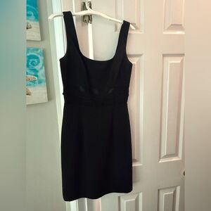 Cute black cocktail dress size 2 with cute waistline accent by Andrea Polizza